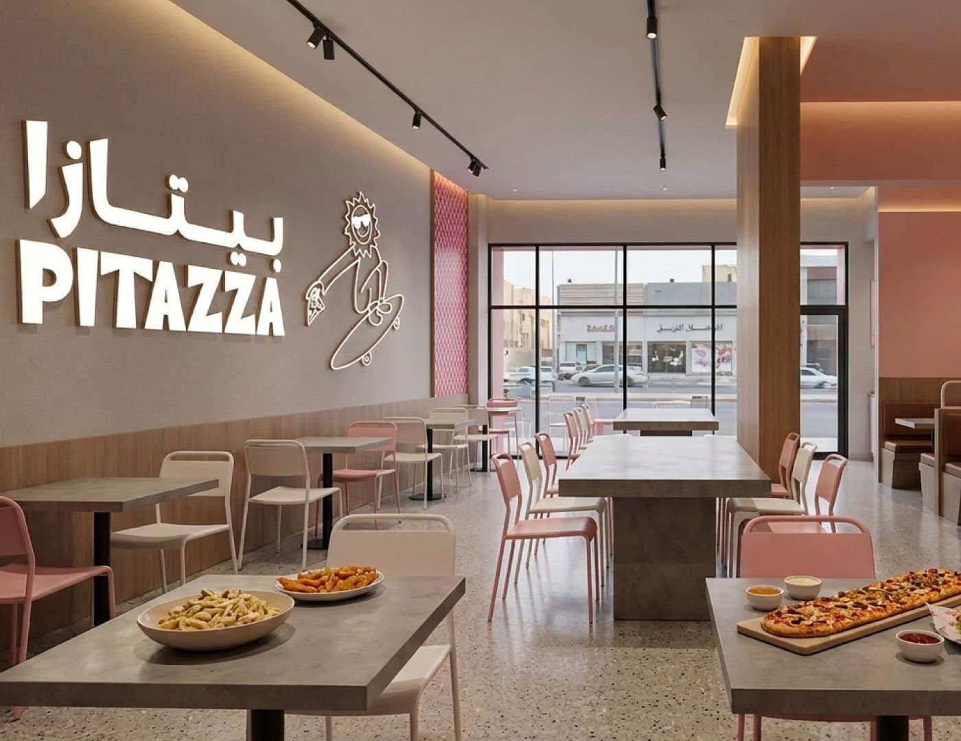 PITAZZA restaurant interior featuring branded wall signage, mascot artwork, modern seating, and dining tables