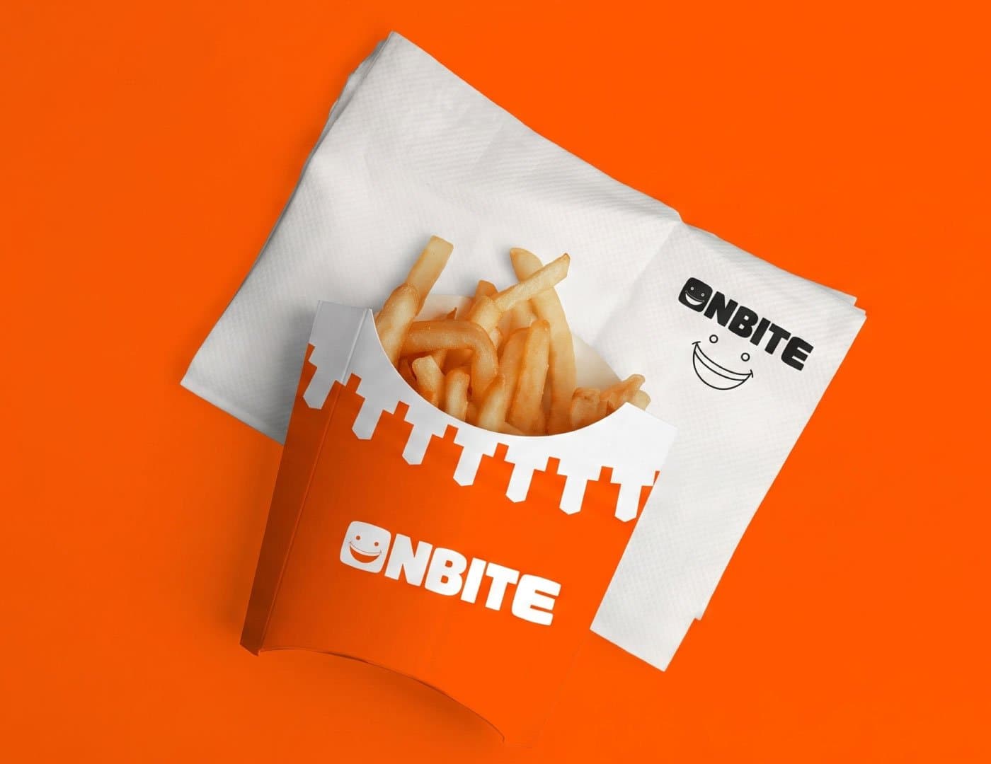 OnBite branded fries packaging with fresh French fries in an orange and white food container
